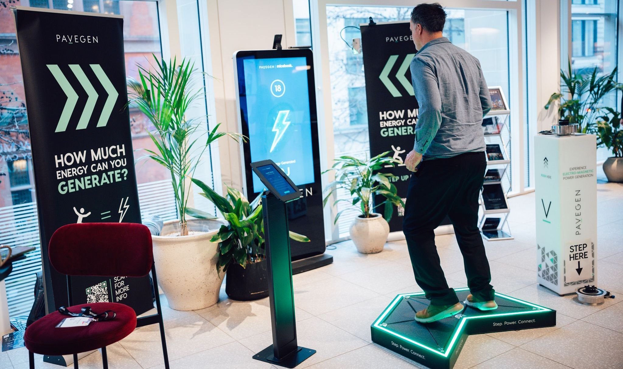 Pavegen Gamestation attendee playing energy game experience at brand event