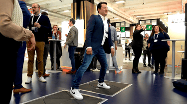 Pavegen trade show technology gameplay with people watching